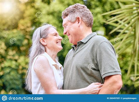 Senior Couple Hug Retirement And Happy Love And Care In Nature