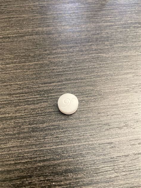 White pill with weird symbol : r/pillidentification