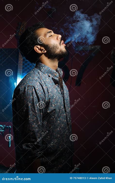 Young Man Smoking Cigarette On Dark Background Stock Image Image Of