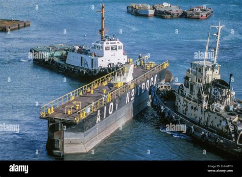 Dry dock gate being maneuvered by tugs at Aioi shipyard, Japan, 3rd ...