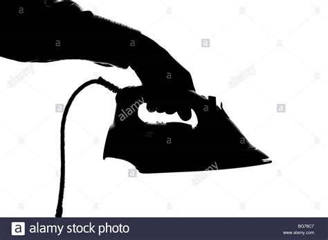 Silhouetted Man Holding Steam Iron Stock Photo Alamy