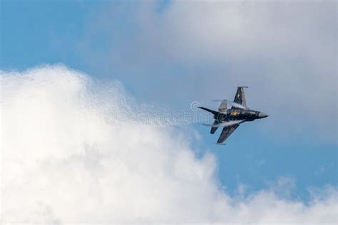 Fighter Jet Soaring Through A Bright Blue Sky Editorial Stock Image