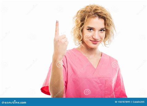 Portrait Of Nurse Wearing Pink Scrub Showing Number One Stock Image