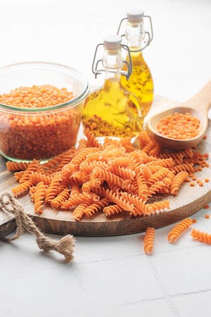 Premium Photo Fusilli Red Lentil Pasta On A Gray Concrete Background