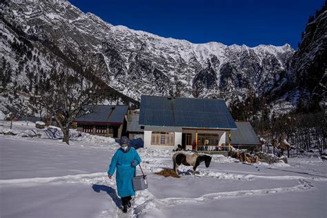 Vaccine workers trek in Kashmir's snowy mountains — AP Photos