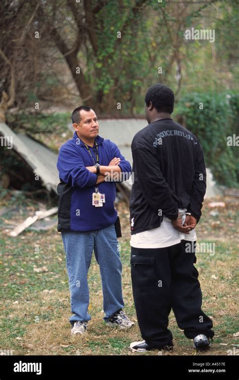 Police officer talking to juvenile suspect Kansas City Kansas USA Stock ...