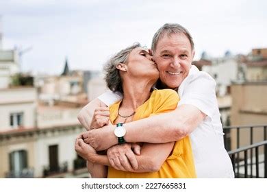 Romantic Mature Woman Kissing Senior Man Stock Photo 2227665831