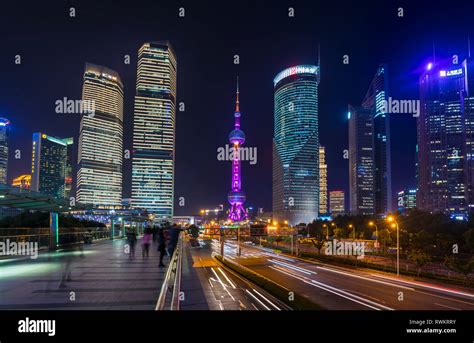 Pudong Skyline And Oriental Pearl Tower From Elevated Walkway At Night