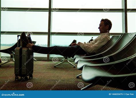 Tired Young Man Lit On Seat In Airport Hall Guy Sleeps He Lean On