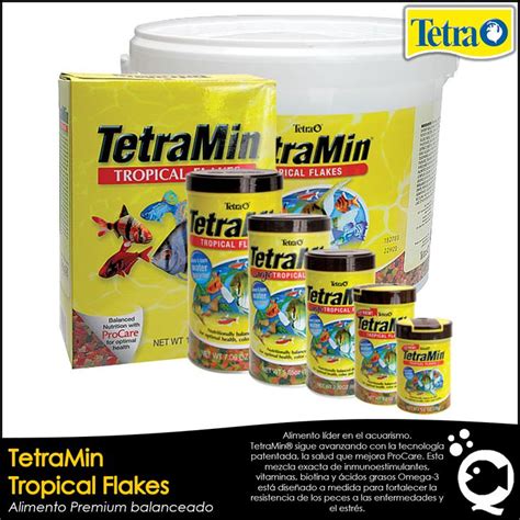 Tetramin Tropical Flakes Are Shown In Front Of A Box And Two Buckets