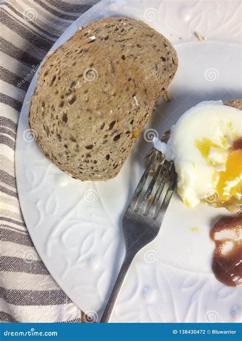 Poached egg on toast stock photo. Image of food, cuttelerybeing - 138430472