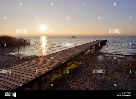 Wooden Jetty At Lake Ammersee In Upper Bavaria During Sunset Stock