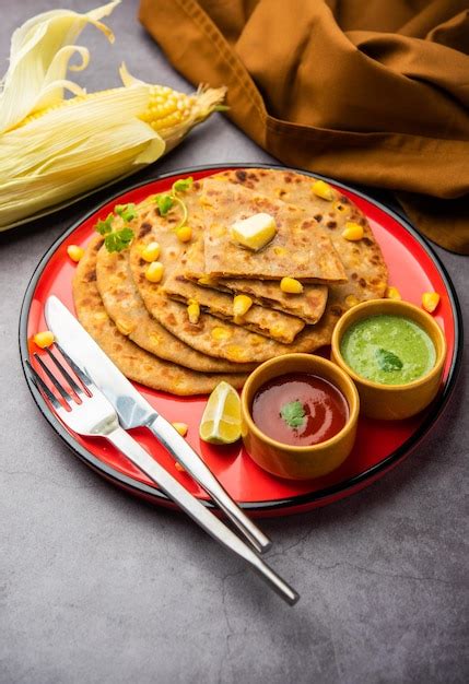 Premium Photo Sweet Corn Stuffed Paratha Or Parotha Served In A Plate