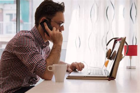 Man Working At Home By Stocksy Contributor Milles Studio Working