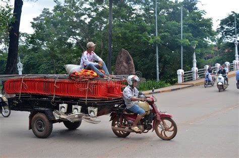 Workers Transport Goods By Motorbike And Cart In Siem Reap Editorial