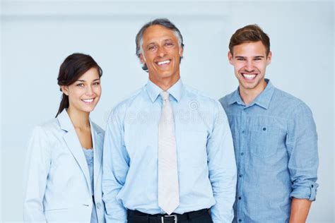 Business Team Of Three Smiling Portrait Of Smiling Business Team With