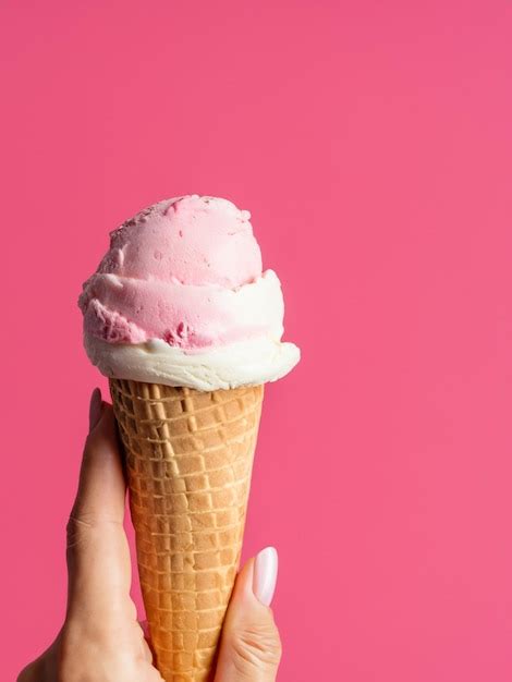 Premium Ai Image Woman Hand Holding An Ice Cream Cone On A White