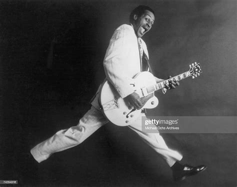 Rock And Roll Musician Chuck Berry Poses For A Portrait Holding His