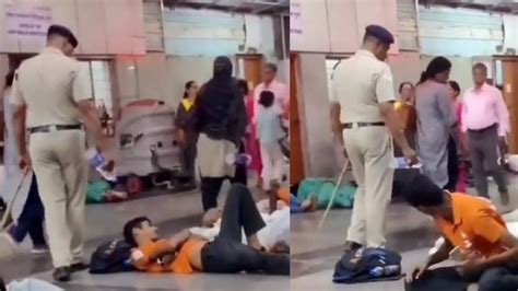 Shocking Cop Pours Water On Sleeping Passengers At Pune Railway