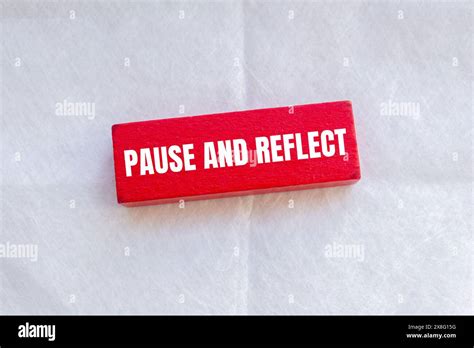 pause  reflect words written  red wodoen block  white
