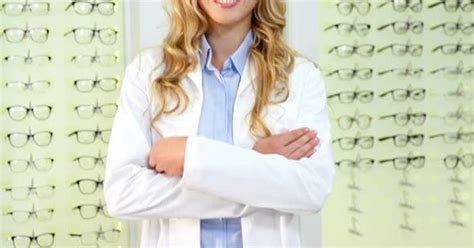 Beautiful Optometrist Standing With Arms Crossed At Ophthalmology Clinic People Stock Footage