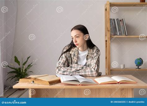 Stressed Asian College Student Tired Of Hard Studying With Books While