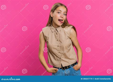 Cheerful Funny Bully Young Woman Showing Tongue Making Silly Faces