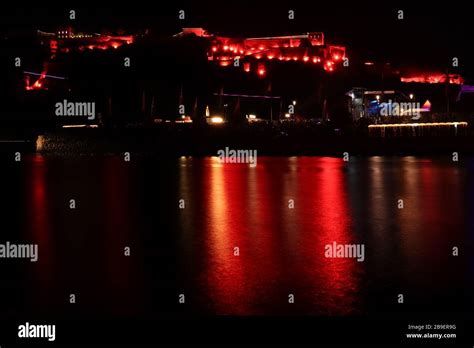 Ehrenbreitstein Fortress Monument lit up in red with reflection in the ...