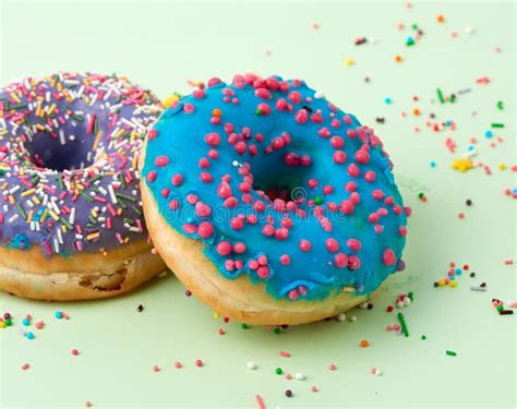 Round Baked Donut With Colored Sugar Sprinkles And With Blue Sugar