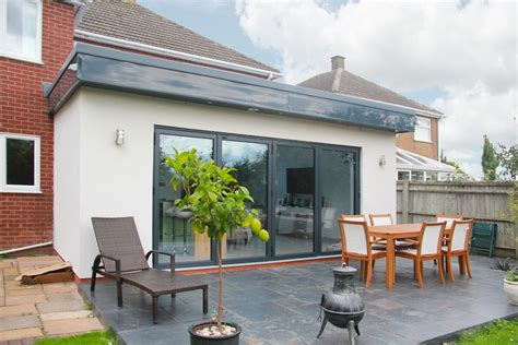 single story flat roof extension transform  home  modern design