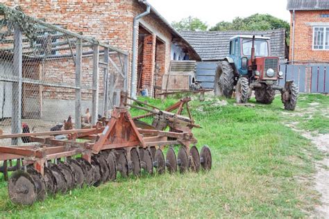 Tractor and Plow on the Farm. Stock Photo - Image of green, chicken ...