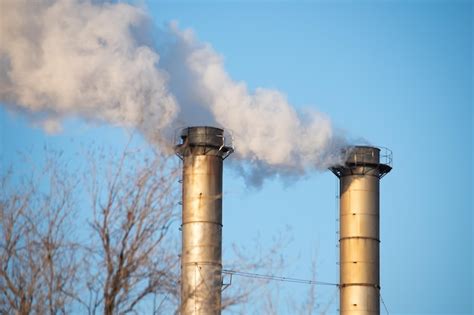 Premium Photo Smoke Emitting From Chimney Against Sky