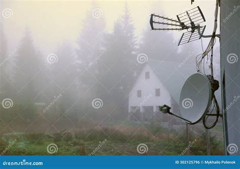 Autumn Rural Landscape With Satellite Dish And House On Background Of