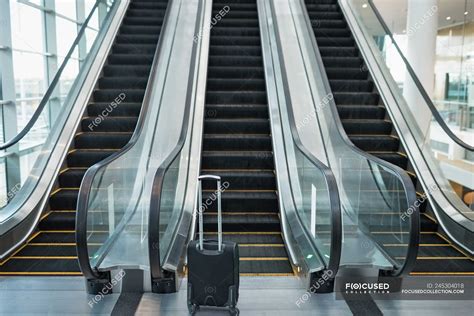 Front View Of Three Escalators Side By Side In The Modern Office