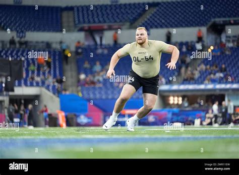 Michigan offensive lineman Drake Nugent runs a drill at the NFL ...