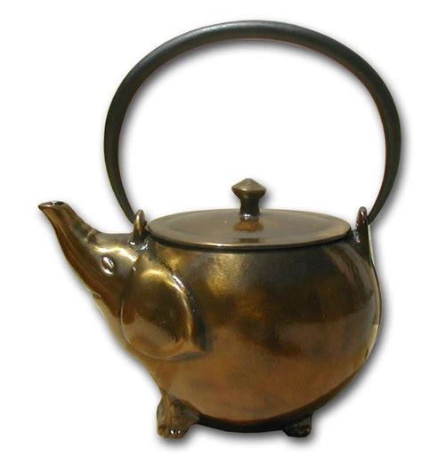 A Teapot Shaped Like An Elephant With A Handle