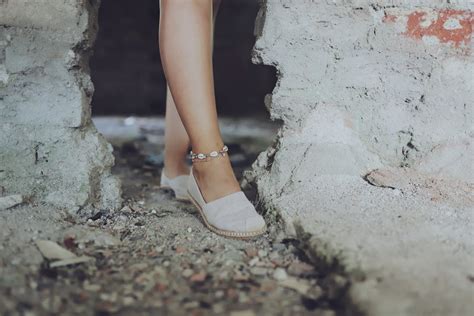 Close-up View of Feet in Shoes on Ground · Free Stock Photo