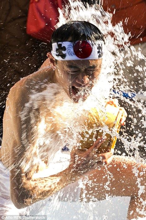 Japanese Bathers Pour Freezing Water Over Themselves In New Year