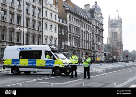 London Uk 23rd Mar 2017 Policemen Stand Guard Near The Houses Of