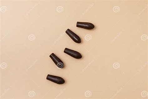 Close Up Of Brown Rectal Suppositories For Vaginal Or Anal Use On A