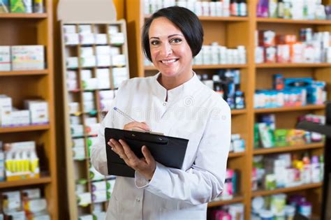 Portrait of Female Pharmacist with Clipboard Stock Photo - Image of ...