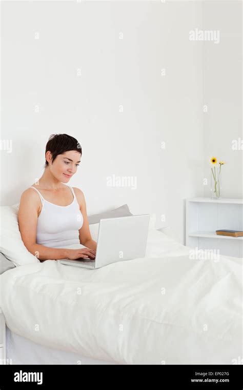 Good Looking Brunette Using A Laptop Stock Photo Alamy