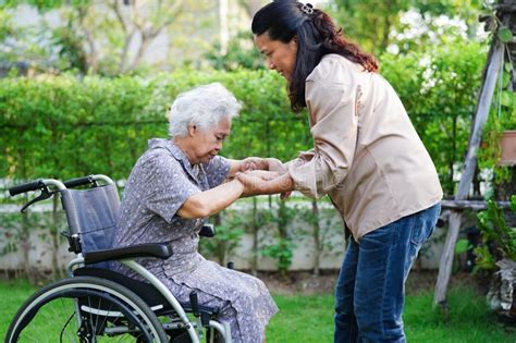 Doctor Help Asian Elderly Woman Disability Patient Sitting On