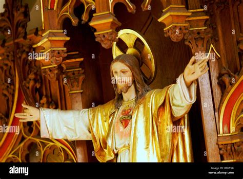 Statue of Jesus Christ with outstretched arms in a catholic church Stock Photo - Alamy