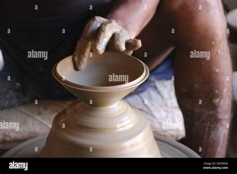 9 October 2022, Pune, India, Indian potter making Diya (oil lamps) or ...