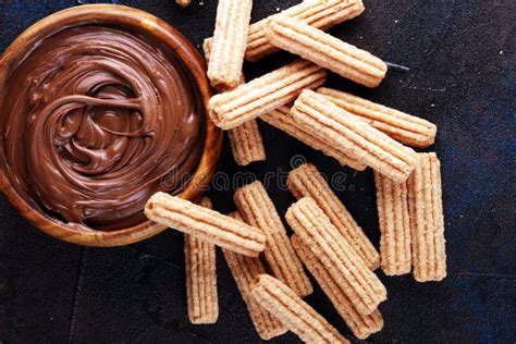 Traditional Spanish Dessert Churros With Sugar And Sweet Chocolate