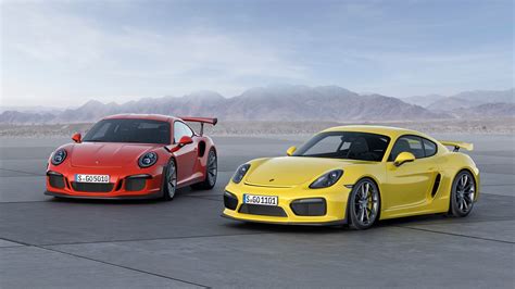 Two Yellow And Red Coupes Porsche Gt Rs Car Porsche Cayman Gt