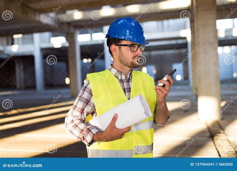 Male Architect Communicating on Walkie-talkie at Site Stock Image - Image of midadult, holding ...