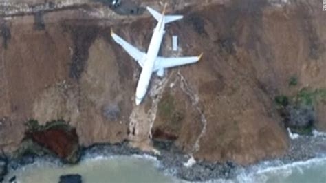 Plane Skids Off Runway Gets Stuck On Cliff Cnn Video