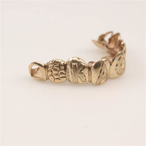 14kt Gold Teeth Caps | Property Room